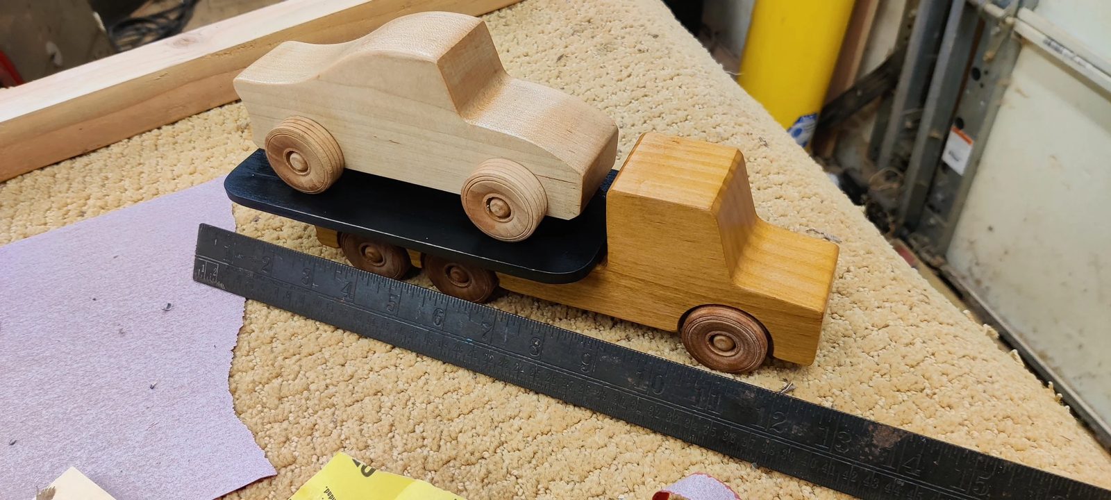 A hand-shaped wooden toy vehicle