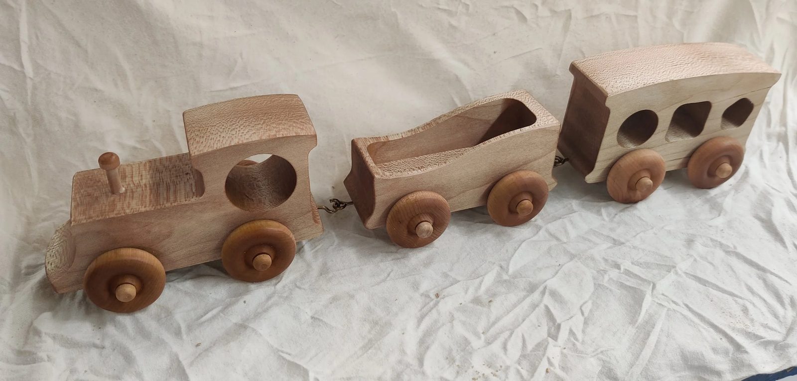 A wooden toy wrapped up as a holiday gift