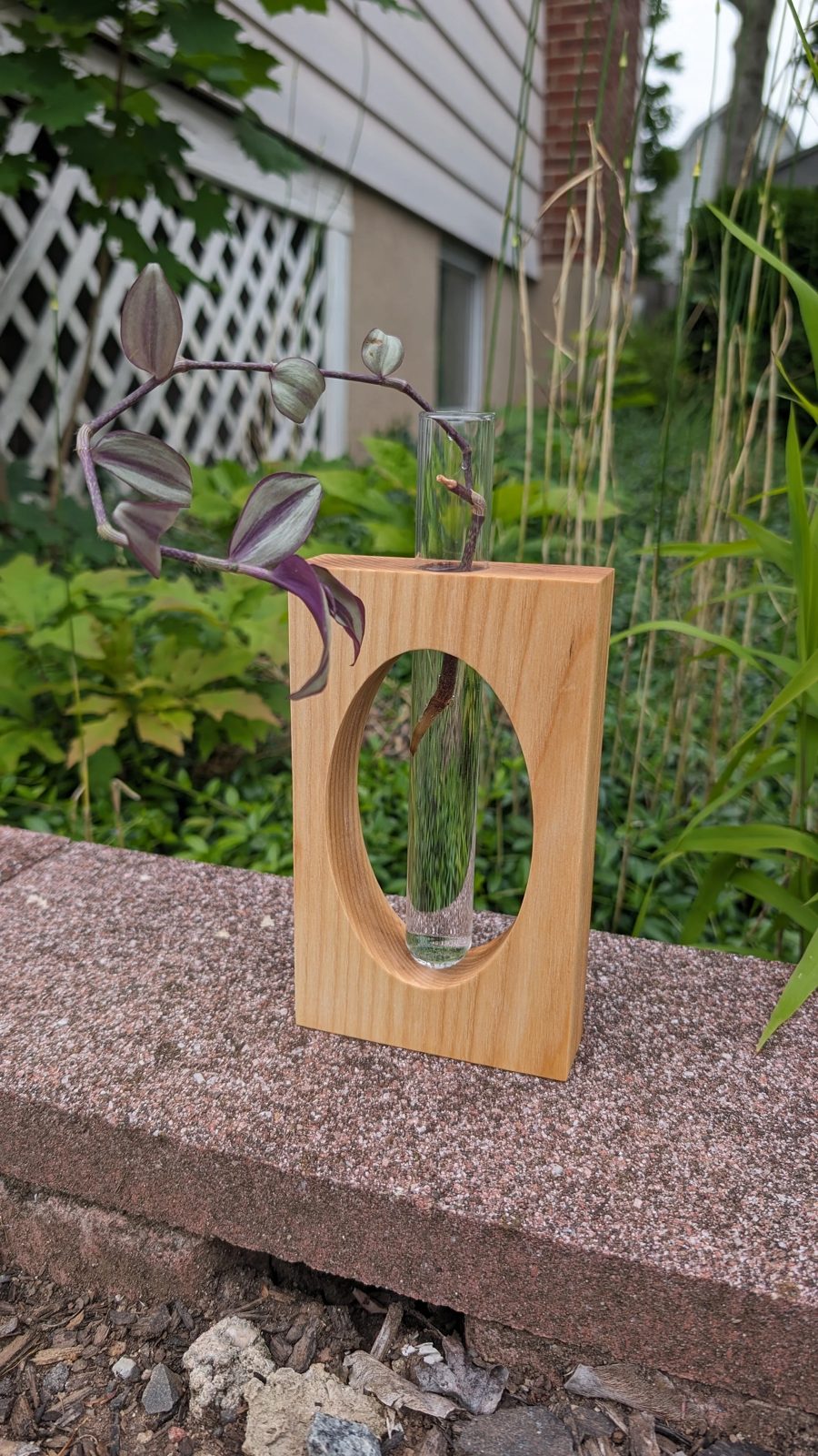 A hardwood bud vase