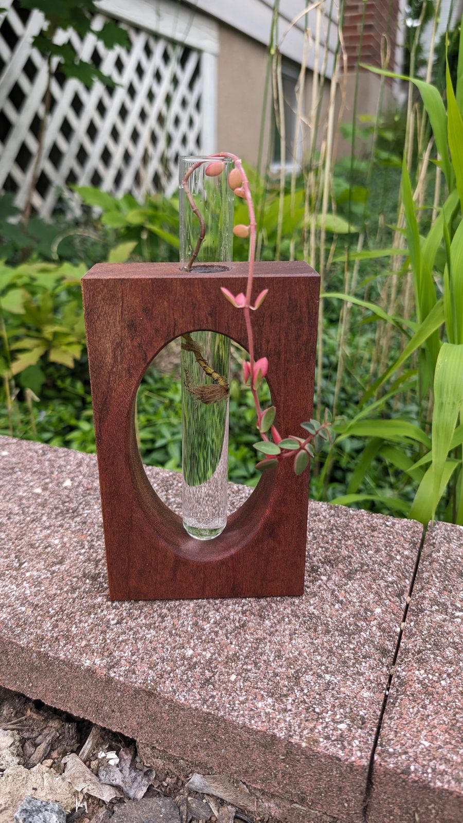 A hardwood bud vase