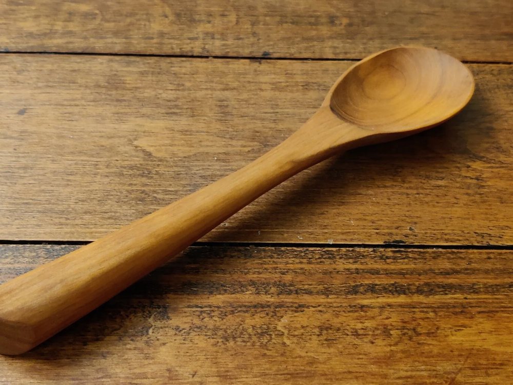 A hand-carved wooden cooking spoon