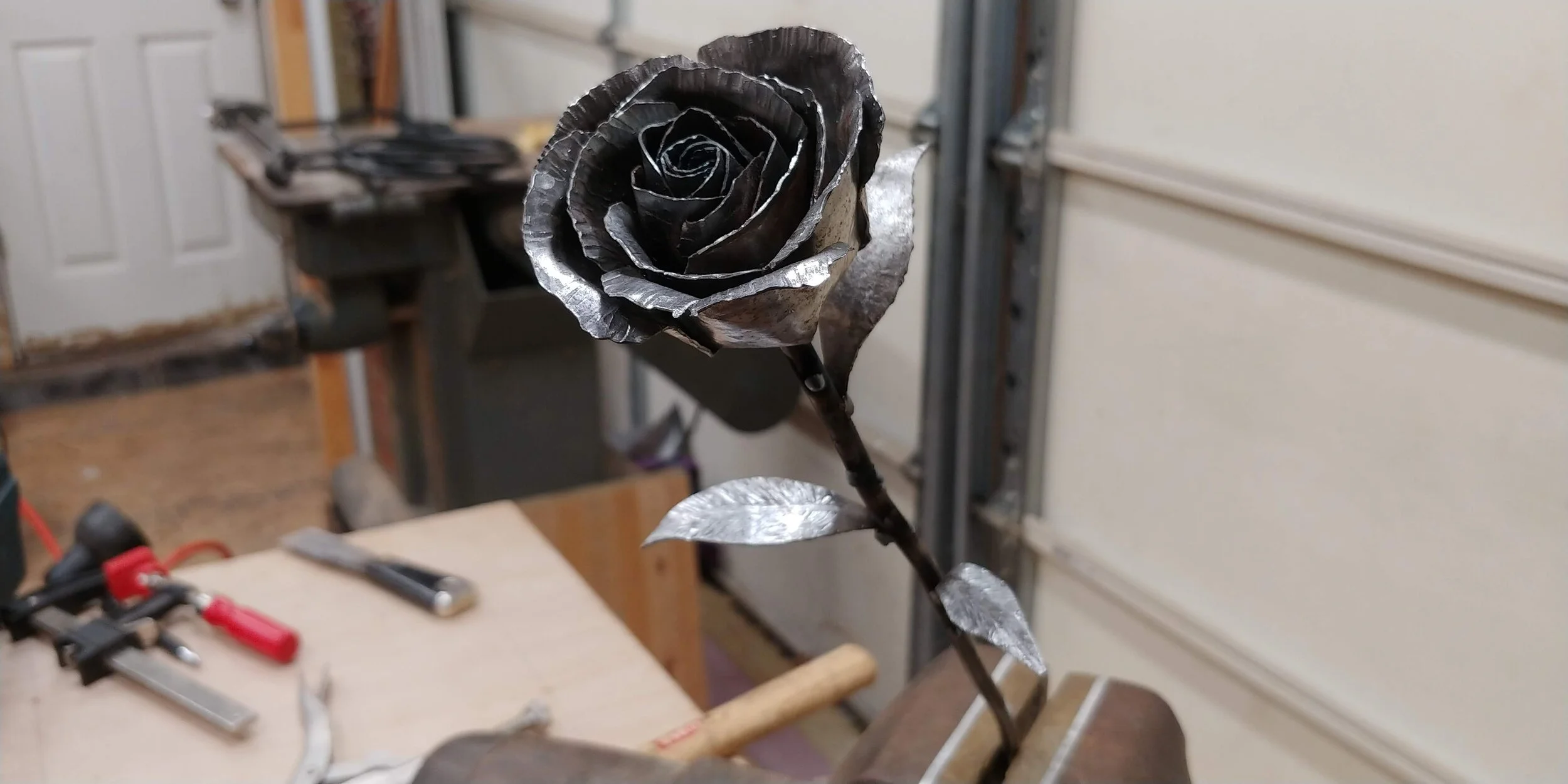 A forged steel rose made in the workshop